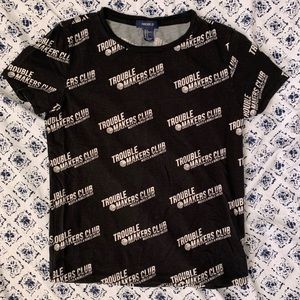 Black shirt with white letters